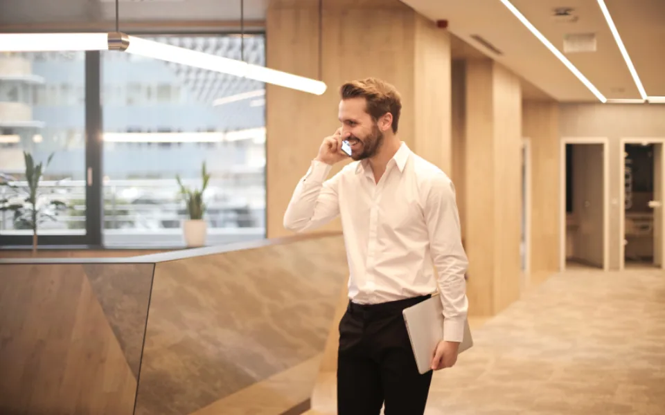 Business owner taking a phone call in the office